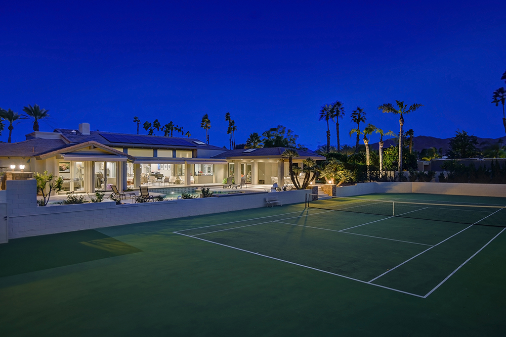 tennis-court-to-house-and-mountains-night-mls